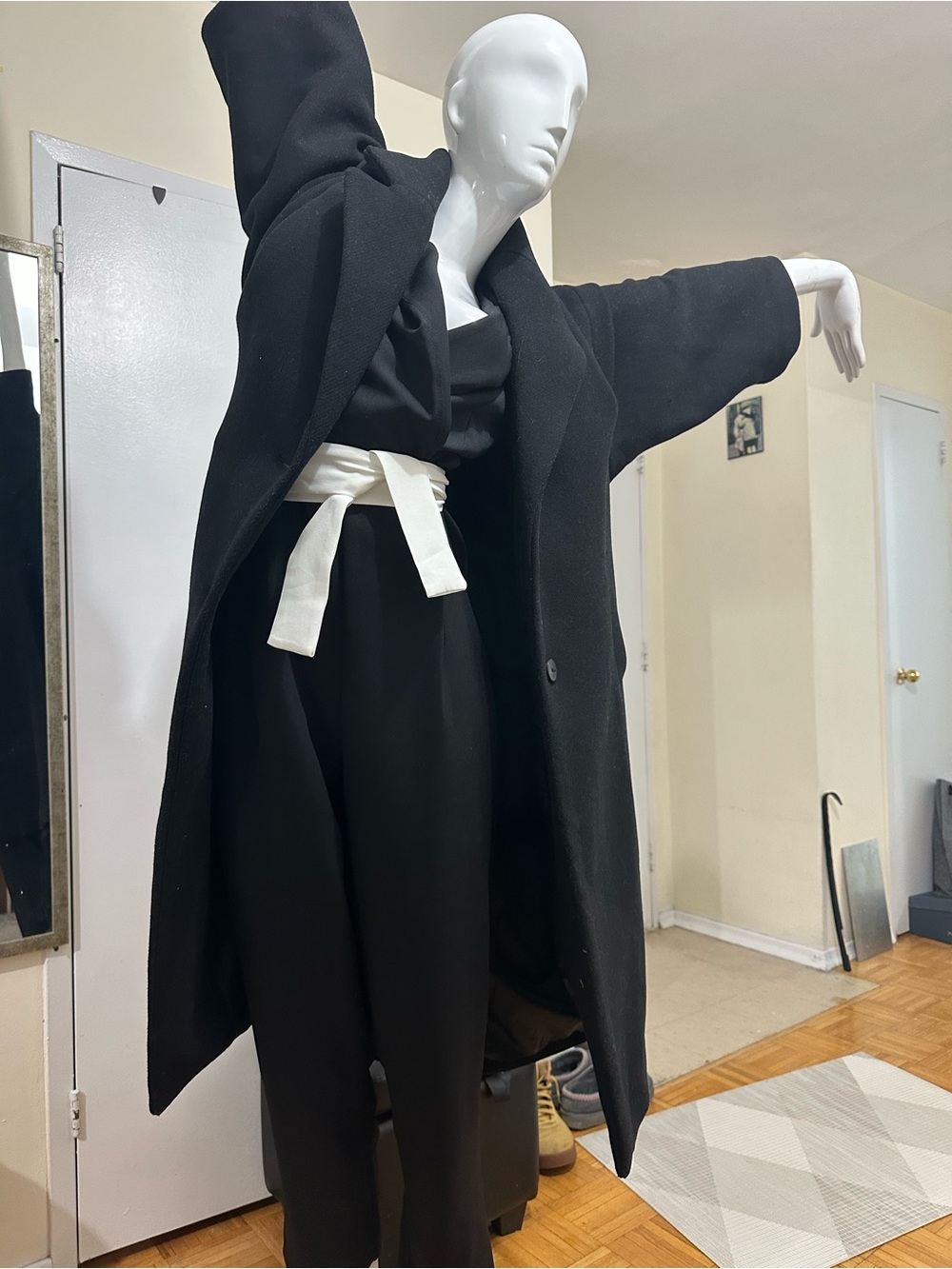 Elegant Black Jumpsuit with Contrasting White Belt